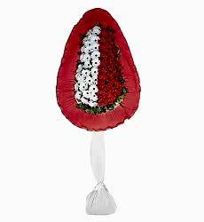 Beyaz ve kırmızı yapay gerbera ile hazırlanmış tek katlı açılış ve düğün çiçeği.